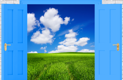 Gentleman sitting hunched over at a desk angrily tying at an old computer.